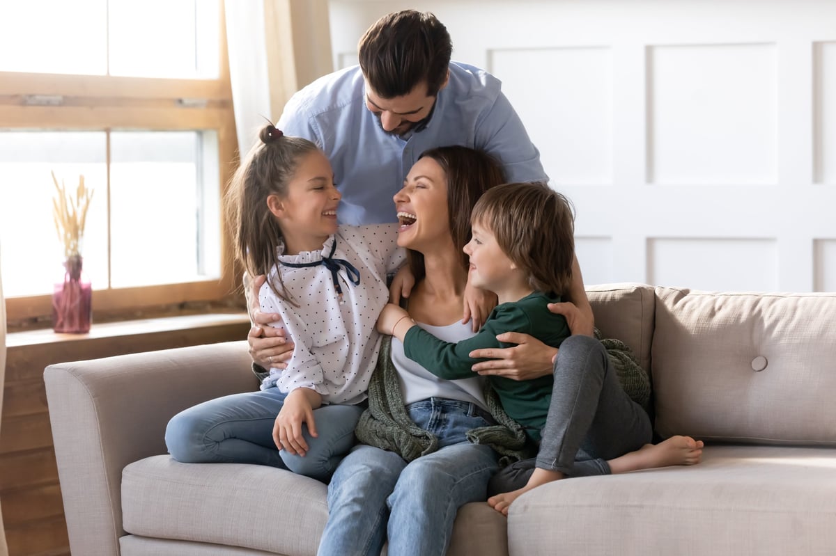 Happy family relaxing together in their living room