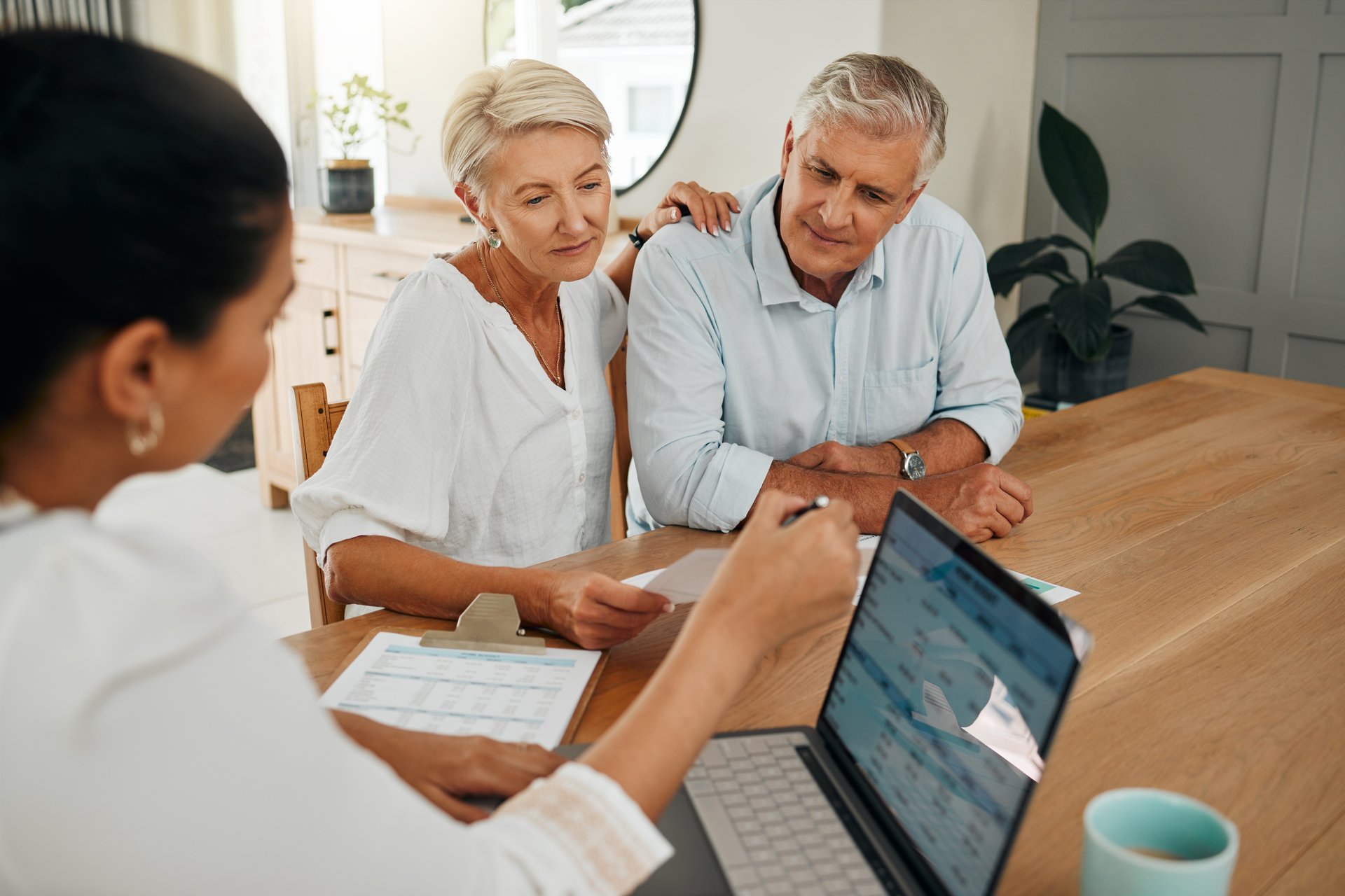 Financial advisor consultation with clients on retirement, finance planning